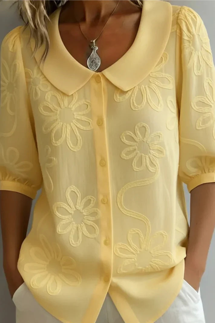 Blusa con cuello floral