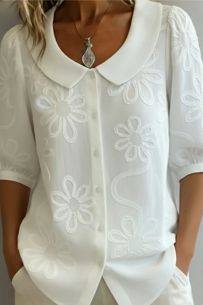 Blusa con cuello floral