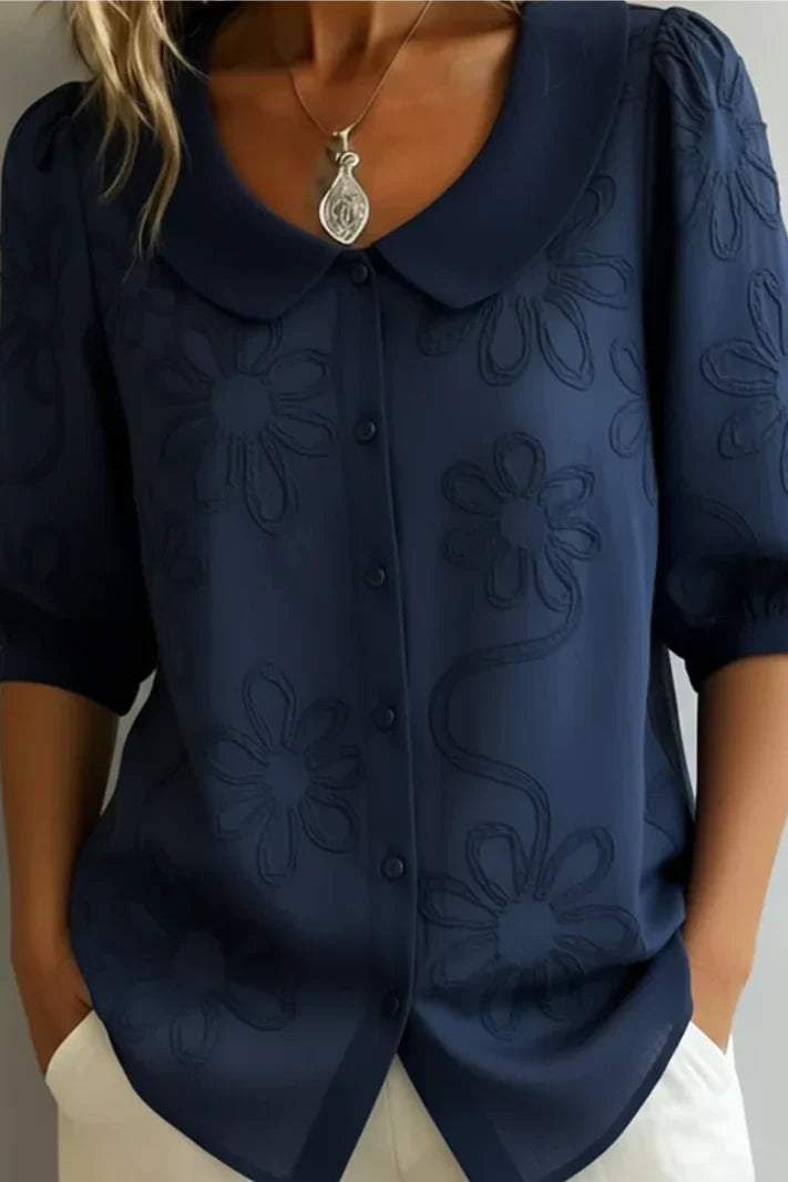 Blusa con cuello floral
